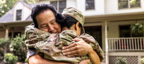 military woman hugging man